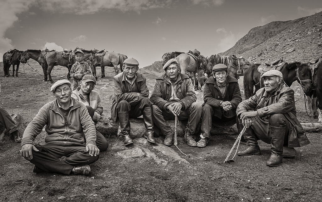 © Dan Burkholder | Men and Boy by Horse Stables, Mongolia