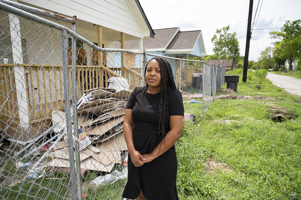 Aledrian looks at some new, unfinished homes across the street from where she grew up in Third Ward. "These houses looked nothing like this when we lived here." Kemp is a youth advocate and professional working in workforce development who moved to Third Ward about four years ago.  She lived in Third Ward as a child with her mother and siblings and wanted to come back and work in the community. “We were in poverty (growing up). Third Ward has always been community driven however I don’t think we get a lot of resources over here. It’s almost like a desert. If you go up to OST (Old Spanish Trail) there’s hardly any stores over here. Most of the food is unhealthy. There’s a lot of homelessness here. It’s a lot of drug activity. Although there’s a lot of community efforts, I don’t know if it’s because people don’t trust it or they’ve been here all their life to the point where they see, “Hey no one’s going to do anything about it so we just complacent and we’re just gonna keep living and do what we do.” But I like this community. I like it for one because this is where most of the African-Americans who were wealthy back in the day built their homes and it was very family oriented. I do wish that we as African Americans advocated more for the community because they’re about to gentrify it. There’s a lot of white people moving in. We are losing that sense of our community and once that’s gone, that’s it. I went to school here. I went to UH because I felt it was more diverse. They do a lot for Third Ward but it’s almost like a white savior type of thing. (They’re attitude is) “We have this big school, we have all this money, so let’s try to do what we can,” but it’s not intentional. It’s not, “What can we do to lift people up in this community and let their voices be heard.” It’s more like them telling community what they need. As African-Americans we need to advocate more for what we need and stop letting people te