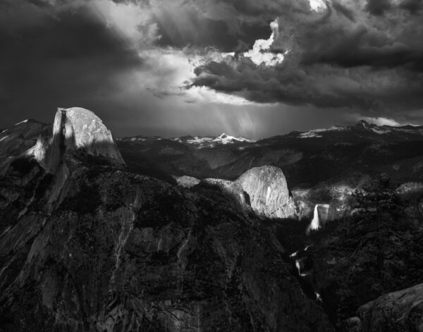 Half Dome and Liberty Cap Illuminated Through Storm Clouds