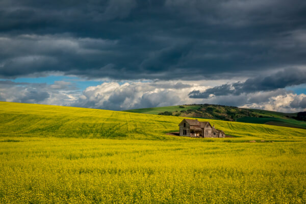 Lone Farmhouse under Stormy Skies